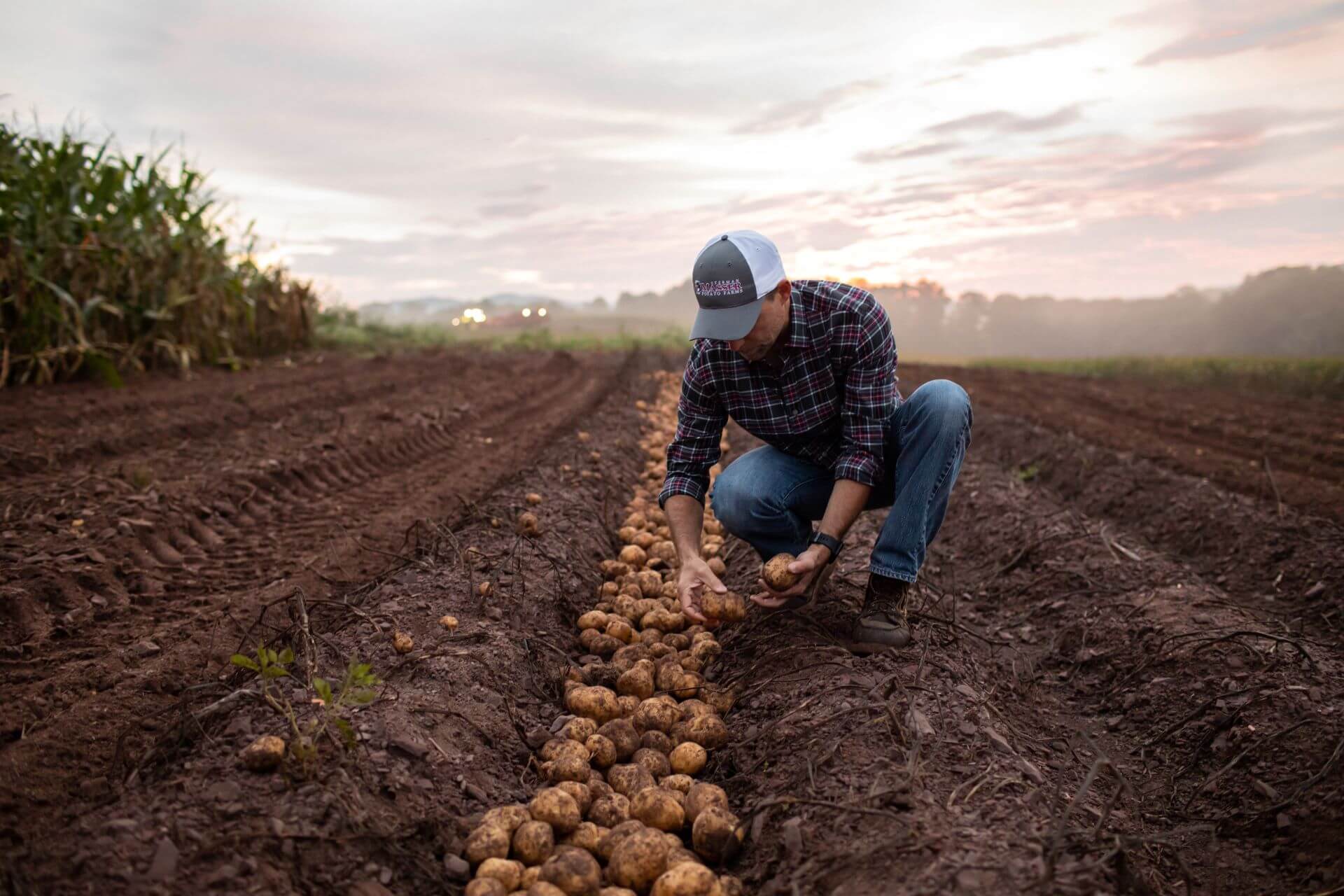 Dave-kneeling-with-potatoes